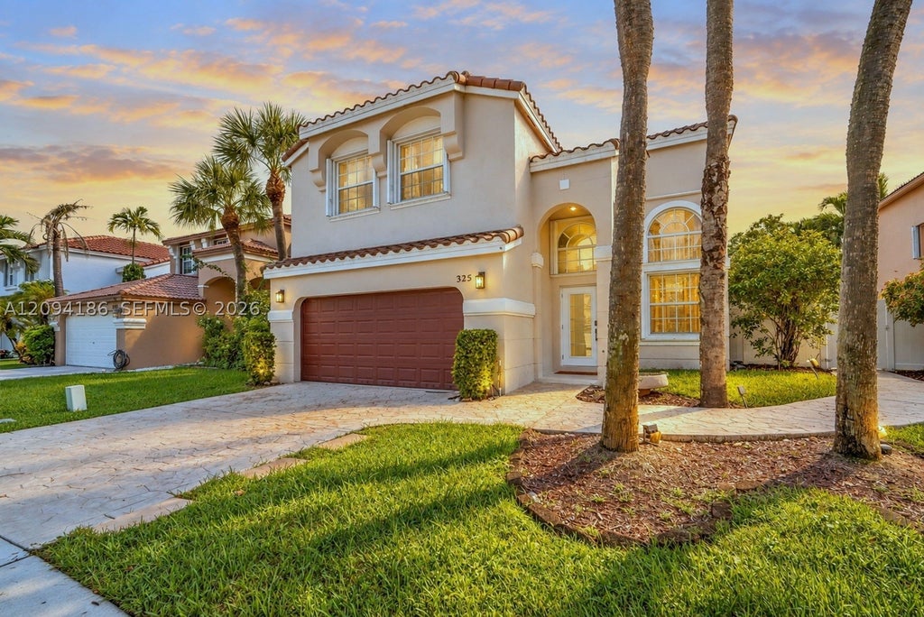 Photo of 325 NW 158th Ln, Pembroke Pines, FL 33028 (MLS # A12094186)