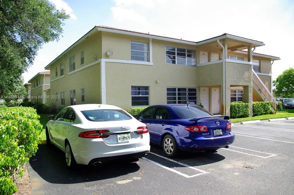 Photo of 808 Twin Lakes Dr #17-F, Coral Springs, FL 33071 (MLS # A11358047)