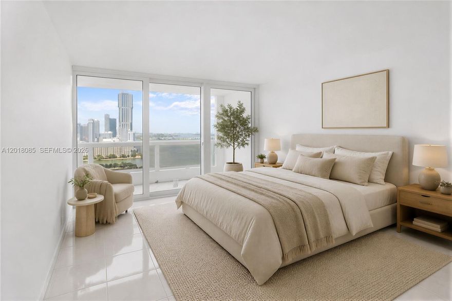 The building features a new lobby and offers spectacular water views from the 27th floor, accompanied by a large balcony overlooking Biscayne Bay and Margaret Pace Park. Both bedrooms and the living room provide stunning water views. The unit spans 1,446 square feet and includes 2 bedrooms, 2 bathrooms, and a large den with a window and a closet. The kitchen features a pantry and offers high-quality finishes throughout the kitchen and bathrooms. Additionally, this property may have the lowest association fees per square foot in the area.

Images featuring furniture are examples of virtual staging.