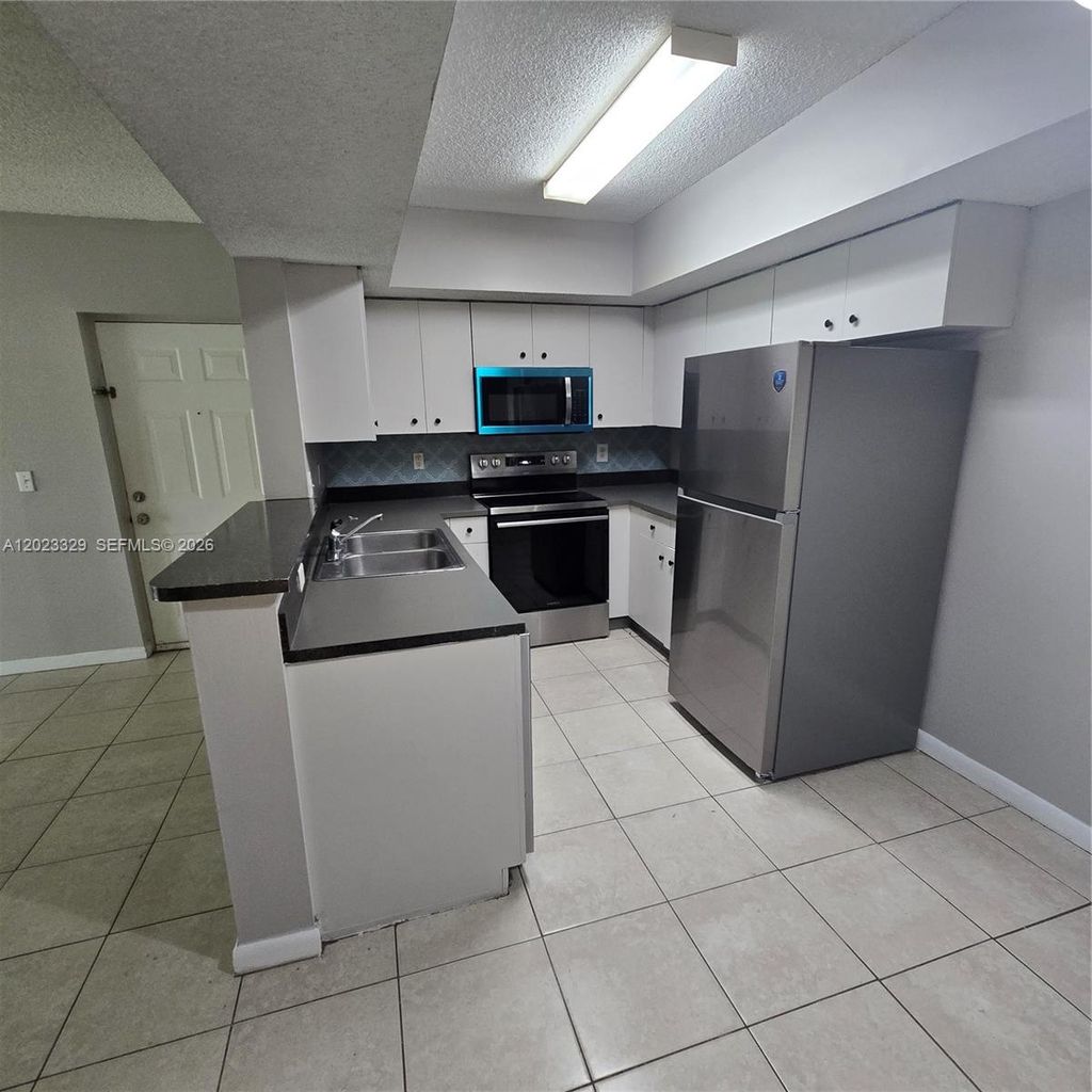 Photo of 5610 NW 61st St #1122, Coconut Creek, FL 33073 (MLS # A12023329)