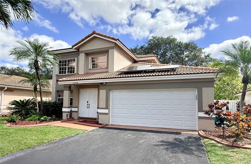 This impressive 2-story pool home offers the perfect layout with the primary bedroom on the first floor, featuring a spa-style soaking tub and separate shower. A finished attic provides tons of extra storage. Enjoy peace of mind with a 3-year-old A/C, eco-friendly solar panels ($65k value), and hurricane accordion shutters. The open kitchen is designed for entertaining with newer stainless steel appliances, gas stove, granite countertops, and flows seamlessly into the living spaces with ceramic and wood flooring. Step outside to a beautiful screened-in heated pool for year-round enjoyment. Additional features include a separate laundry room with brand new washer & dryer and a two-car garage for convenience. Close to major highways, shopping, dining, and excellent schools. Low HOA!