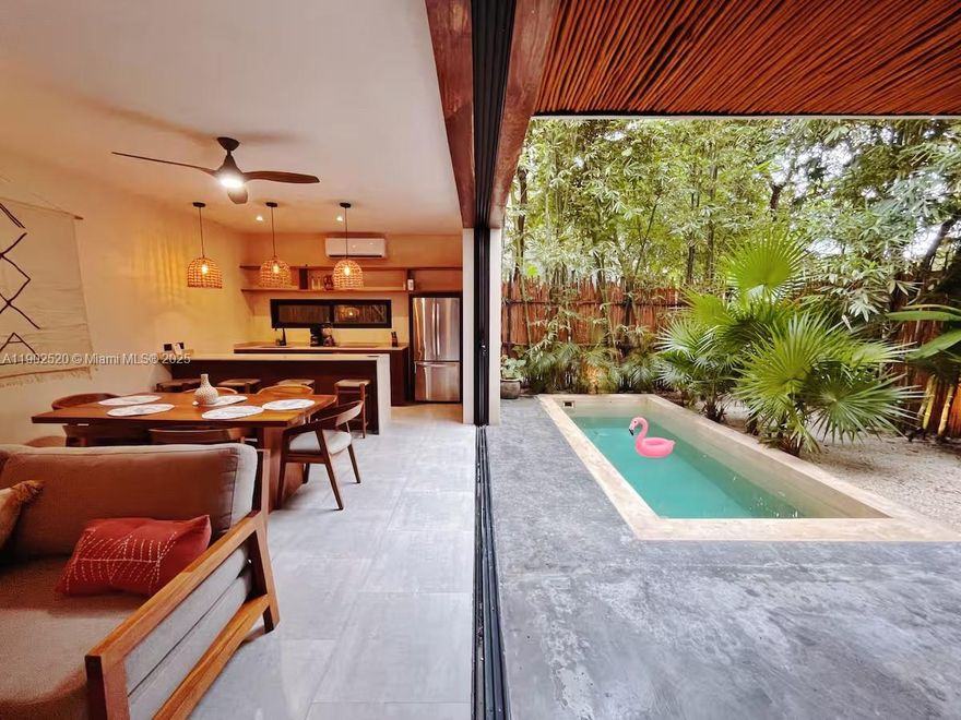 Gorgeous modern villa in the heart of Tulum, fully furnished with 2 bedrooms & 2.5 bathroom with 2 floors & a rooftop sun deck with plunge pool.  Located in a gated community - Atman Residences, surrounded by a lush forest, this 148 m² villa completed in 2021 is designed for relaxed indoor outdoor living.  Enjoy incredible outdoor private spaces: roof top terrace with plunge pool, balcony, garden with a 2nd private plunge, and private outdoor grill area. 1 outdoor parking space and private entrance. American kitchen, fully equipped with induction appliances.  Air conditioning. Community amenities: gym area and pool. Modern design and natural beauty combine in this perfect villa for an unforgettable stay in magical Tulum.