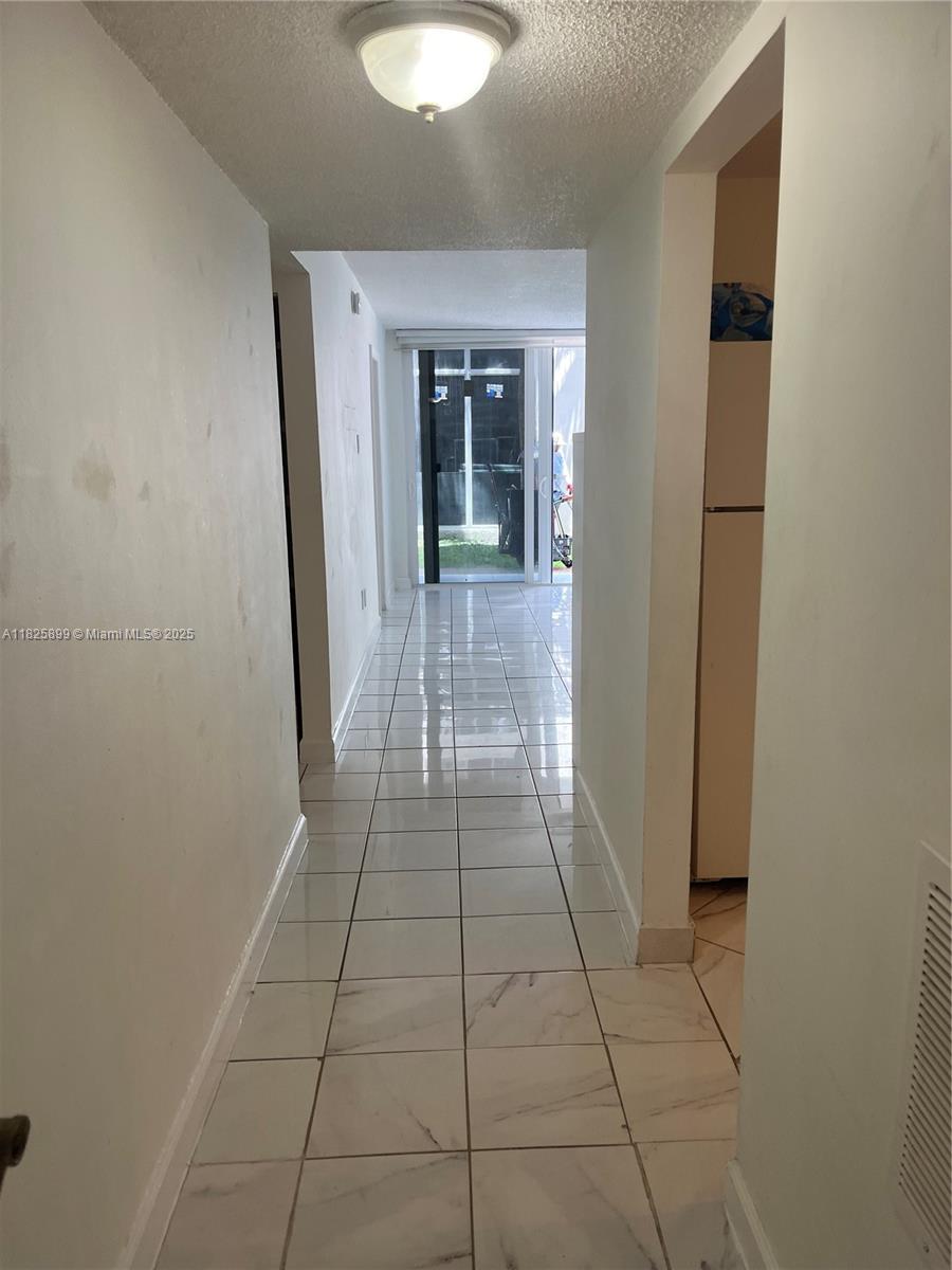 Stunning 2BR/2BA Condo in the Heart of Hialeah Gardens! Welcome to this bright and inviting first floor corner condo offering the perfect blend of comfort, convenience, and Florida charm. Light-filled living space with an open layout. Two spacious bedrooms with ample closet space, and two full baths. A private balcony overlooks lush greenery and serene community spaces—a peaceful retreat. In-unit washer/dryer for added convenience and ease. Assigned parking + guest spots. Gated, pet-friendly community with 24/7 security, sparkling pool, playground, and picnic/BBQ area—resort-style amenities. Minutes from Palmetto Expressway (SR?826) and Florida’s Turnpike for easy commuting. Just seconds away from Westland Mall, Palmetto Hospital, top-rated schools, shopping, dining, and entertainment.