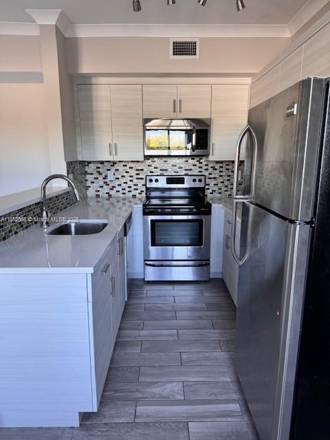 **SHOWINGS MAY BEGIN SEPT 1ST** 1/1 in the heart of the City Beautiful! Modern updated kitchen featuring SS Appliances, white quartz countertops, contemporary cabinets & sleek tile backsplash. Central AC, spacious closet, washer and dryer *IN-UNIT*! Ceramic wood-look tile throughout, chrome hardware, white crown molding. Lots of natural light. Third floor unit, no elevators. Entire building has Hurricane Impact windows & doors, as well as 24-Hr Video Surveillance. Street parking only. 1 Pet allowed up to 35 lbs with non-refundable pet fee. Rent covers water, sewer, trash removal, pest control. Please TEXT ONLY for any questions. Please request showing via Showing Assist. Credit 650+.