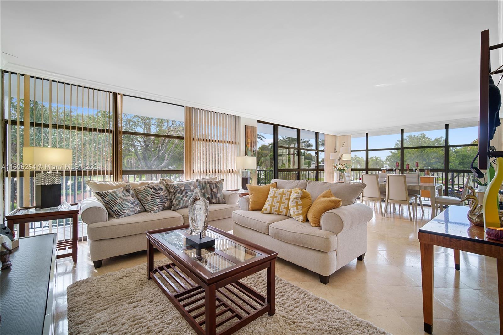This flawless 2/2 corner unit has been completely renovated, featuring floor-to-ceiling windows, a wrap-around balcony, and captivating tropical garden views. The kitchen is equipped with granite counters, stainless steel appliances, and recessed lighting. Enjoy a spacious master closet, remodeled bathrooms, and the convenience of an in-unit washer/dryer hook-up. Towers of Oceanview South provides resort-style living with amenities like a heated pool, tennis courts, fitness center, and 24-hour security. Ideally located just minutes from the beach, shopping, dining, and casinos, with a shuttle to local shopping and Aventura Mall. Additionally, residents have Wi-Fi access in common areas. Call or Text for a showing!