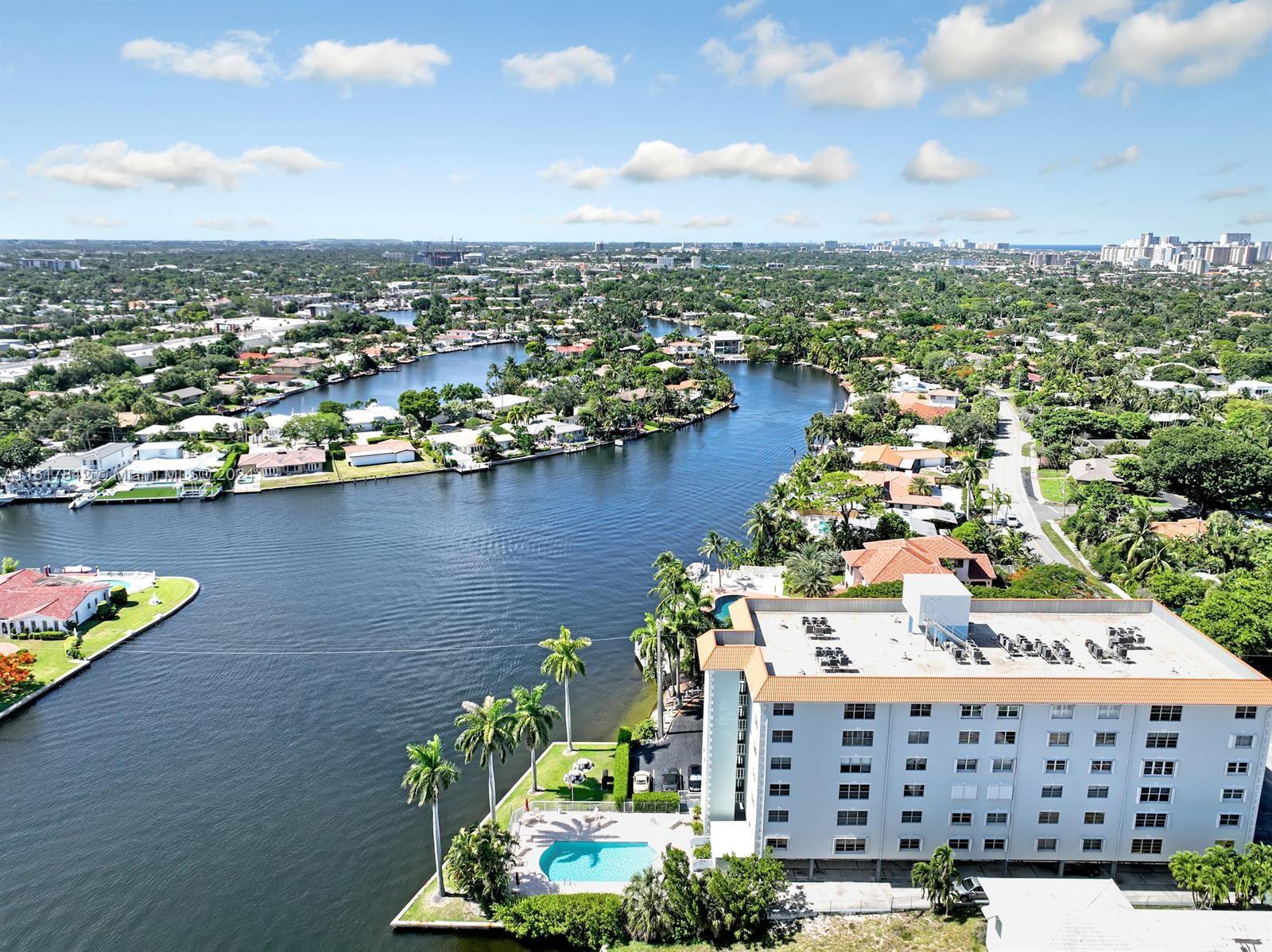 Price Improvement! Owner financing Available~ Very Spacious2Bdrm w/ den ~ East Fort Lauderdale on The Middle River in Coral Ridge. 'A' rated Bayview Elementary School District. Corner unit updated with Bamboo flooring in living areas & Bedrooms. White Shaker cabinetry/ Granite countertops/ Impact Windows/ Plantation Shutters. Master bathroom has dual vanities. 2nd bathroom is a 'Jack and Jill' between the other two bedrooms. Gorgeous views of the Middle River. Convenient to downtown, shopping, dining, Ft. Lauderdale Beach,Holy Cross & Imperial Point Hospitals, and schools.Assigned under building parking and secured lobby.Beautifully maintained pool on the river. Investors can rent immediately.No Washer and dryer in unit.Association doesn't maintain full reserves, o 25% down if financing