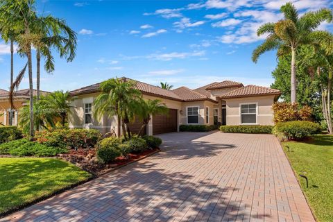 Photo of 11425 NW 75th Mnr, Parkland, FL 33076 (MLS # A11844288)