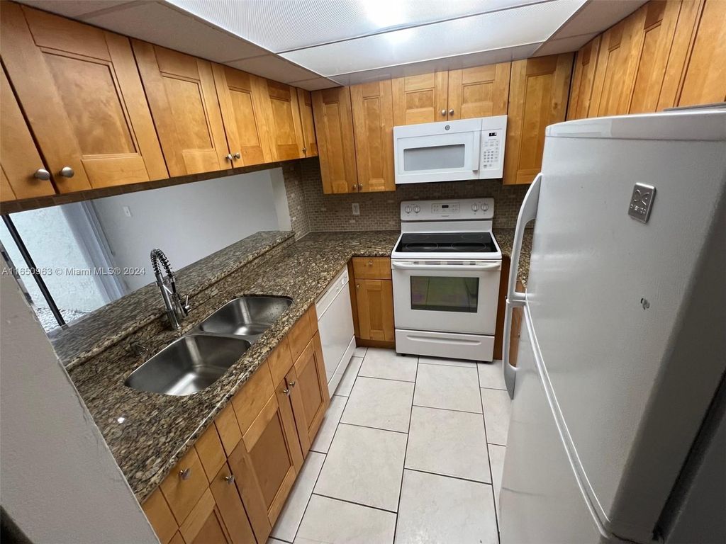 Photo of 9343 SW 1st St #802, Plantation, FL 33324 (MLS # A11650963)