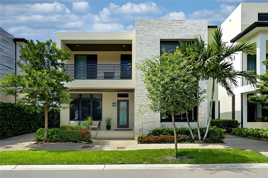 Discover this elegant 4-bed, 4 bath home in the heart of Downtown Doral. Enjoy a private pool oasis perfect for relaxing or entertaining. Every detail is professionally designed with integrated LED lighting and high-end finishes. The gourmet kitchen boasts premium appliances, a quartz waterfall island, and built-in refrigerator. Smart-home tech controls lighting and systems; the primary suite offers electric blackout curtains, private balcony, and spa-style bath. Additional bedrooms have balconies, blackout curtains, and one with en-suite bath. Spacious living, dining, and family areas flow seamlessly. Parking for up to 6 cars includes EV and golf cart charging. Impact windows. Experience the luxury lifestyle you deserve.