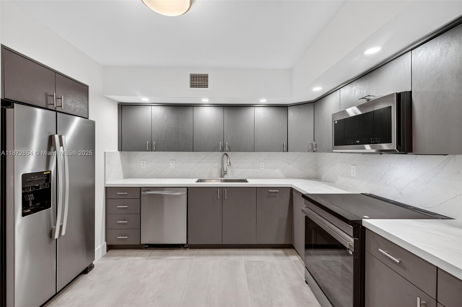 Modern 1BR/1.5BA Condo – Fully Renovated!
Step into luxury living in this spacious 1,008 sq ft condo featuring a screened-in porch with serene courtyard views. Enjoy a stunning modern kitchen with quartz countertops, porcelain tile floors, & brand-new washer/dryer, lighting, fans, and A/C. 2 walk-in closets,3 linen closets,Storage unit. Large Screened in porch for quiet time
The community offers resort-style amenities: a heated pool with jacuzzi, tiki hut with grills, gym, and billiards room. Perfectly located near beaches, top restaurants, shopping, airport, and major highways — plus walking distance to shul. 24 hour security, Guard gate, Walled, Covered Parking
,
Move-in ready and designed for comfort, this home combines style, convenience, and relaxation in one perfect package