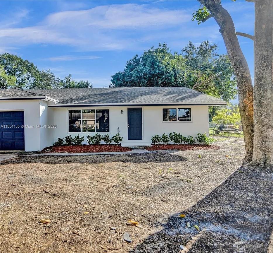 Rare opportunity, single story, 1/2-acre lot in sought-after community of Davie. This picture-perfect property features an open floorplan, 4 bedrooms, 2 baths, garage and a sprawling backyard that is perfect for a spa pool, park, garden and more. The home was recently fully remodeled and features a UPDATED kitchen, stainless steel appliances, Vinyl waterproof flooring, impact windows and garage door, granite countertops, designer bathrooms and recessed lighting throughout. Roof is new along with the AC and water heater. Won't have to worry about a HOA and short distance to Hard Rock Casino, Ft Lauderdale airport and beaches. The home goes from one street to another. Schedule to see TODAY!