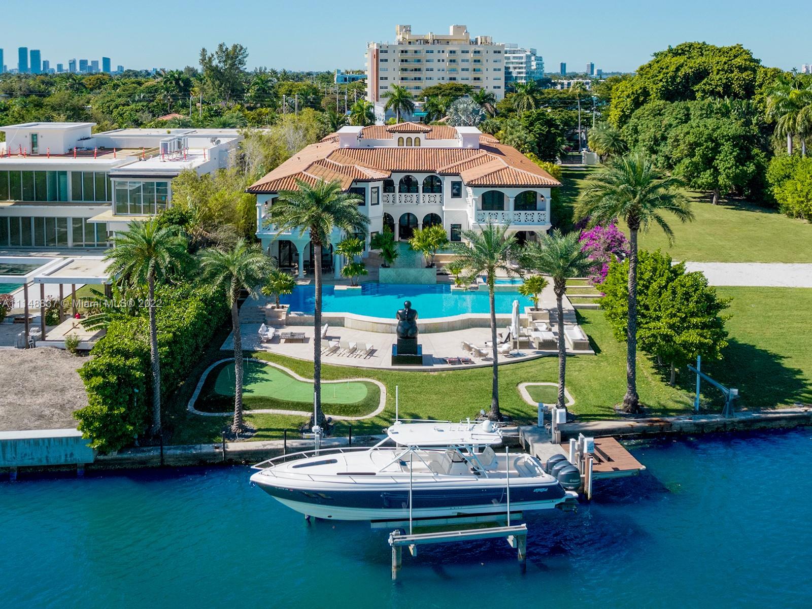 A magnificent gated estate - Villa Sole is designed for palatial living on Miami Beach’s storied Pine Tree Drive, with views over Indian Creek and glimpses of the ocean beyond. On an oversized 44,000 square foot lot with 100 feet of water frontage, the 19,530 square foot home is rich in architectural details, including twin grand staircases, a stately great hall to rival any castle, intricate tilework and moldings, and stones from around the world. Unique features include a velvet-paneled home theater complete with miniature box office, a palatial master suite, two pools, a lighted tennis/basketball court, two guest apartments, a billiards room and bar, and a full hair salon.