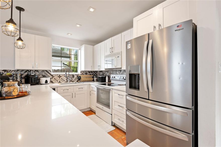 Charming single-family home in Cutler Bay! Upon entry, you're welcomed by a cozy living room featuring a built-in wine and coffee bar perfect for entertaining or unwinding. The kitchen features include white cabinetry, quartz countertops and an open layout overlooking the family room. The split-bedroom floor plan places the master bedroom separately from the two additional bedrooms creating privacy and comfort. Enjoy additional highlights such as the spacious backyard ideal for outdoor gatherings, ample parking, comfortable laundry room and more.