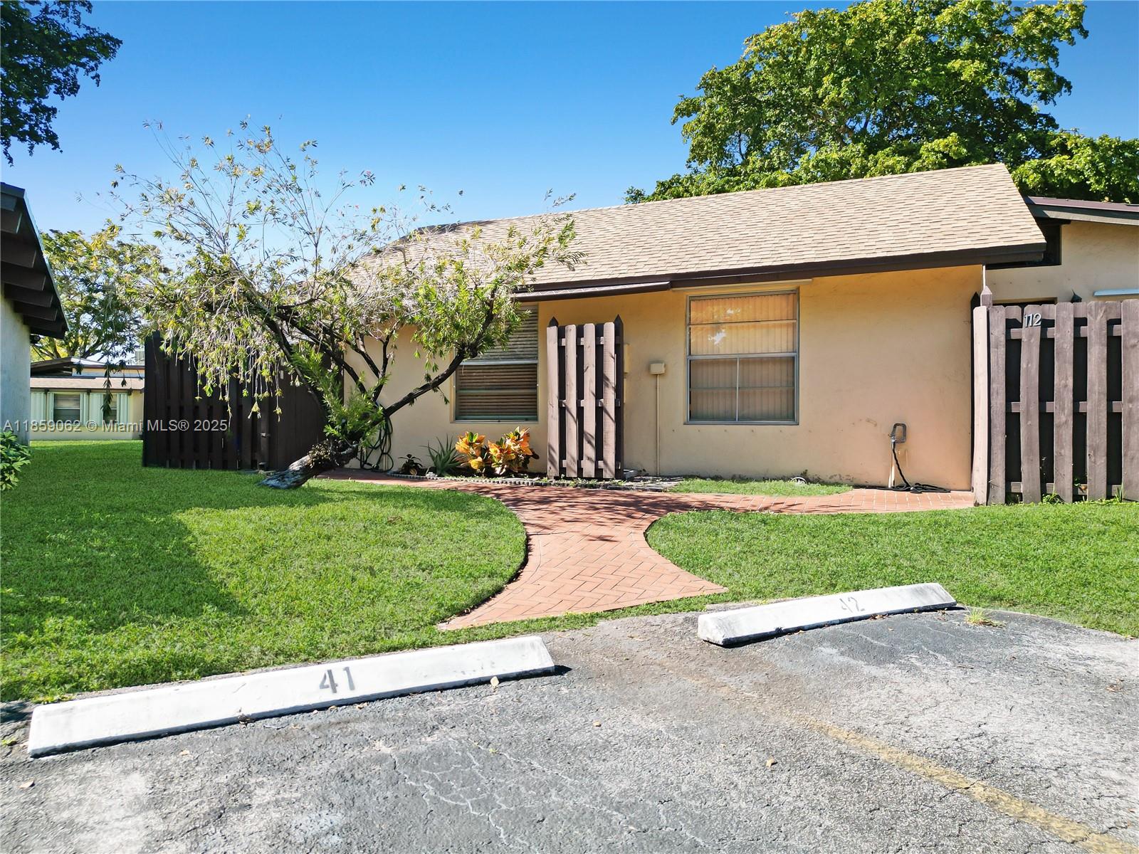 Gorgeous, light & bright, this freshly painted 2 bed, 2 bath gated community one story villa is waiting for you! Featuring an open concept layout with laminate flooring throughout spacious living areas, a generously sized kitchen with granite countertops & soaring vaulted ceilings. Offering amazing outdoor living space with a fenced front porch, extended sunroom & lots of green space! Full size washer & dryer in home for convenience! Carriage Hills amenities include a million dollar clubhouse with 3 pools, spa, jacuzzi, game room, gym, tennis & more! Close to Hard Rock Casino, Publix, beaches, dining, shopping and transportation. This active senior living community has it all! Association requires 650+ credit, 1 occupant 55+, all others 18+. Pet friendly up to 25 pounds.