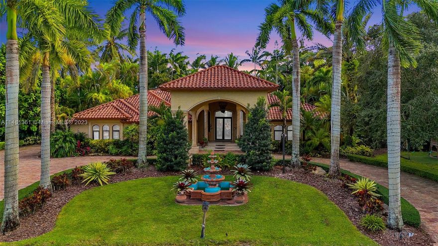 Welcome to your own Tuscan paradise! This stunning 6-bed, 4-bath estate showcases the perfect blend of opulence and comfort. Admire the opulent Travertine and Brazilian Cherry wood floors, along with the grandeur of the soaring coffered ceilings in the living area. Enjoy the warmth of the gourmet kitchen and cozy fireplace, perfect for intimate gatherings. Step into your private tropical oasis, complete with a heated pool and jacuzzi, mesmerizing Koi Lagoon Ecosystem and cascading waterfalls. Indulge in the convenience of the grand porte-cochere entrance, impact doors and windows throughout, luxurious marble pavers, a whole house generator, and exquisite custom built-ins that enhance the allure of this exceptional home. This is the epitome of luxury living at its finest!