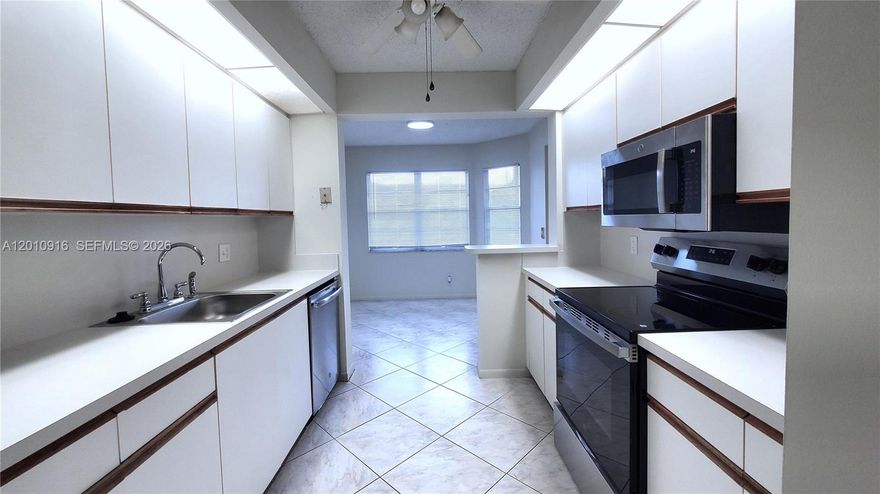 Move-in-ready 2-bedroom, 2-bathroom condo located in the highly desirable community of Century Village at Pembroke Pines. This freshly painted unit features brand-new stainless-steel appliances, new kitchen counters, tile floors throughout, and an enclosed balcony/sunroom offering picturesque views of the golf course.  Equipped with central A/C (less than six years old), the convenience of in-unit washer and dryer, the security of accordion hurricane shutters, and the ease of access via the building’s elevator. Spacious primary bedroom has an ensuite bathroom, and both bedrooms feature large walk-in closets.  
Enjoy a resort lifestyle in one of the most prestigious 55+ communities in Southwest Broward. Community amenities include a multi-million-dollar clubhouse, state-of-the-art theater, 18-hole golf course, multiple swimming pools, fitness center, tennis and pickleball courts, movie theater, organized clubs and activities, café, guard gate, 24-hour security patrol, courtesy shuttle transportation, and much, much more. Close proximity to major highways means convenient access to shopping, dining, and medical facilities. Easy to view – make an appointment today!