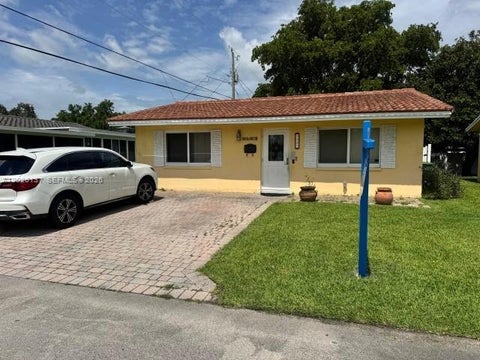 Photo of 5403 NW 27th Ave, Tamarac, FL 33309 (MLS # A12026137)