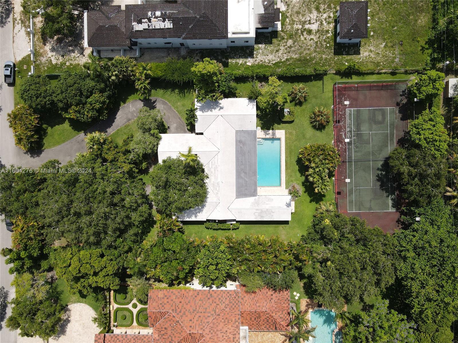 Fabulous opportunity in prime N. Pinecrest! This 3 BR, 4 BA plus office/playroom home spans 3,477 SF and is located in the Pinecrest Elementary School District! Situated on a builder’s acre on a no-traffic street, the property also features a pool and tennis court. The home includes wonderful, open living spaces & an eat-in kitchen w/ granite counters & stainless steel appliances. The primary suite includes a large walk-in closet & spacious BA, while 2 additional BRs, one with an en-suite BA, each have great closet space! The deep covered patio is ideal for indoor/outdoor entertaining, & is accessed via impact glass sliding doors. Other features include carport, 2-car gar, laundry rm, wood floors, & impact glass. This is a great home to rent or live in while preparing to build new!