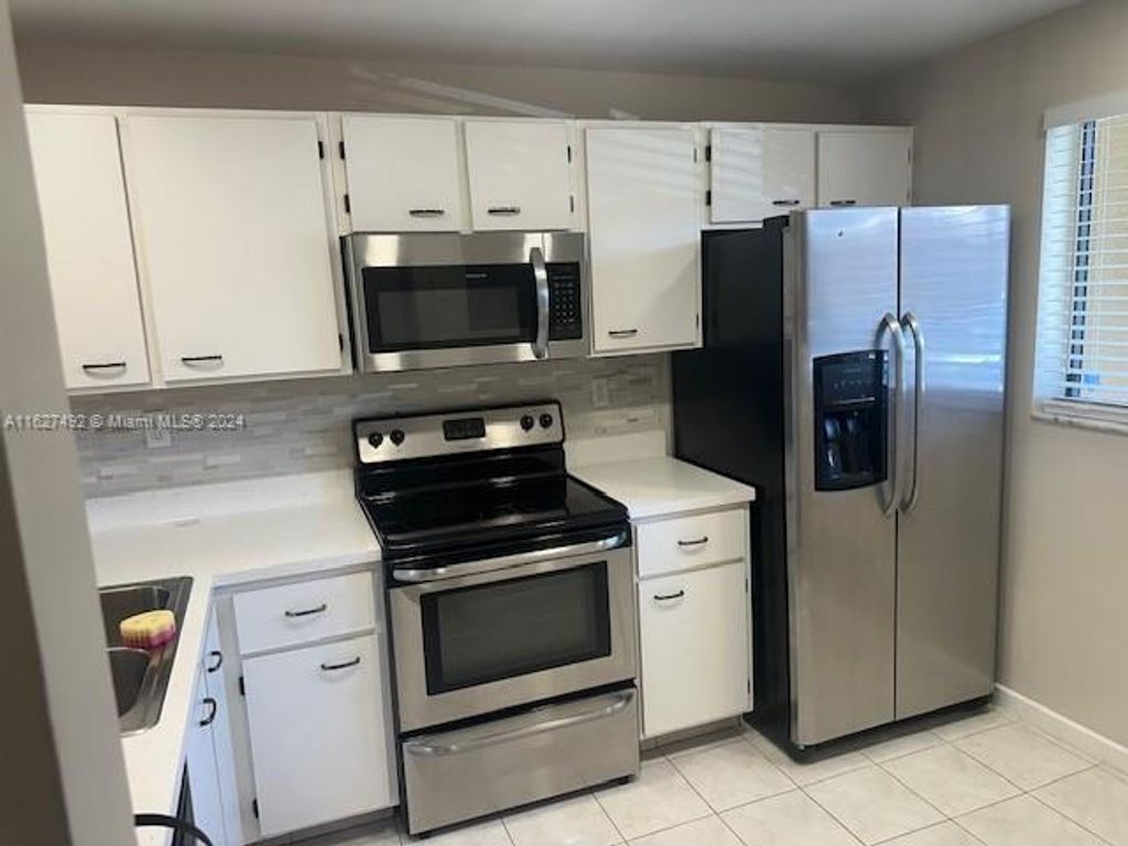 Photo of 9539 Boca Cove Cir #101, Boca Raton, FL 33428 (MLS # A11627492)