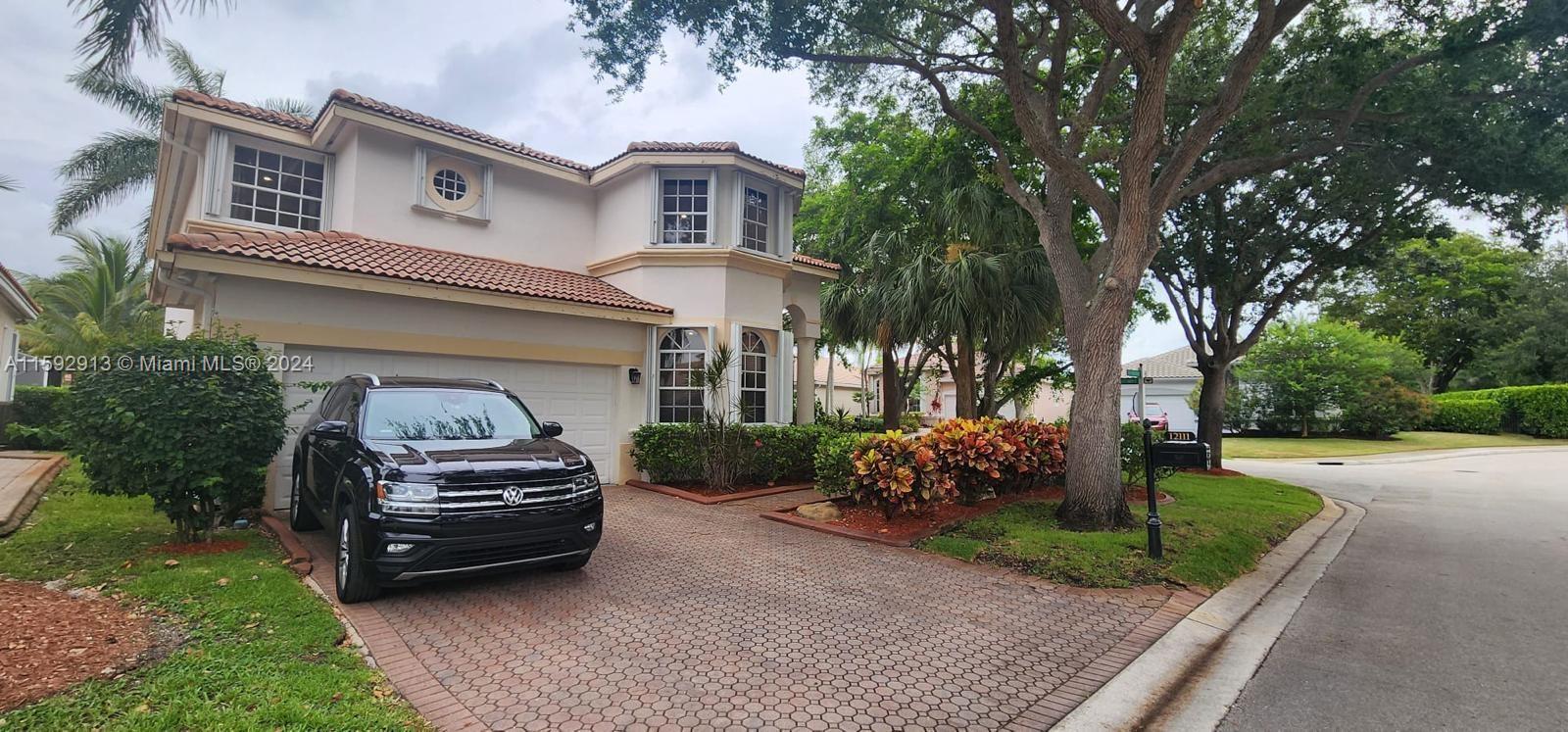 Beautifully, renovated 4 bed/ 3 bath Pool Home on an oversized corner lot in the prestigious gated golf community of Eagle Trace. Featuring an open layout w/hight ceilings plenty of natural light. Spacious living and dining room. Large Kitchen w/adjoining family room overlooking the pool and backyard, features granite countertops, S/S appliances, wood cabinets, pantry and breakfast bar. Offers a convenient bedroom & a full bath downstairs. The stairwell opens to spacious loft & a huge master suite w/open balcony overlooking the pool; walking-in closets and ensuite bath w/his and her vanities, roman tub, and separate shower. Large fenced pool and screened patio. Accordion shutters. Hurricane resistant garage door. Close to shops, restaurants and A-rated schools. Low HOA! No approval needed.