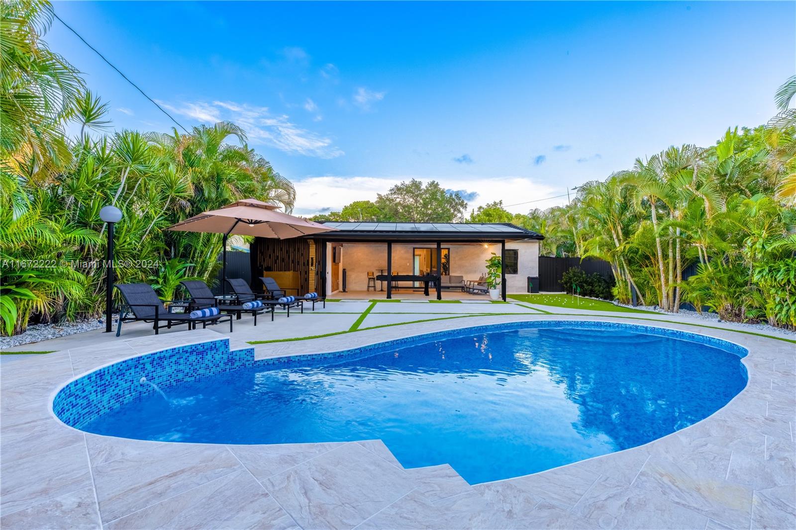 This spectacular, fully renovated Fort Lauderdale property combines modern design with a prime location, just 8 minutes from the beach. This property is an excellent investment, generating over $150,000 in annual income. All furnishings and amenities are included in the sale price. The kitchen and dual master bathroom provide convenience and luxury. Additional features include: Solar panels covering 100% of electricity. Over $300,000 in high-quality remodeling, including fine ceramic tile work on the exterior walls. Luxury pool and jacuzzi, perfect for enjoying the Florida weather. BBQ area. Impact-proof windows and doors. Landscaping with irrigation system and automatic exterior night lighting. Great opportunity!