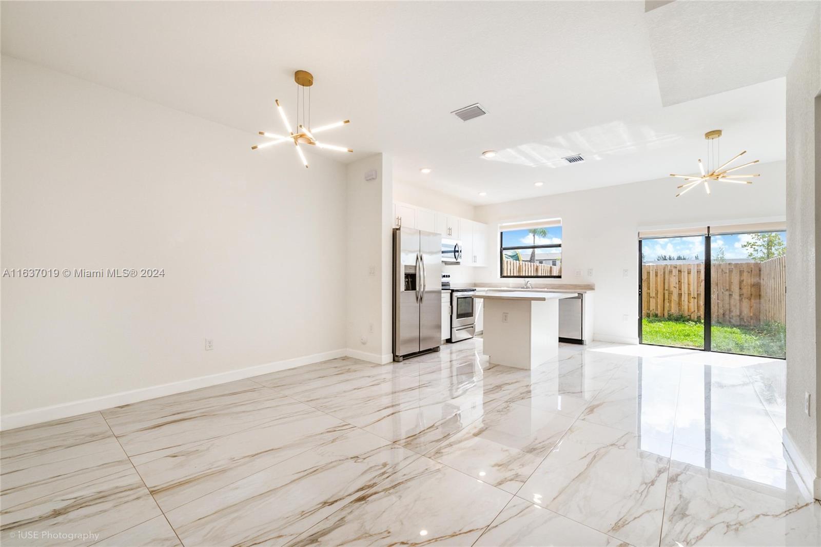 *Seller will pay 6 months of association fees in full price offer* Welcome to modern luxury in this 3-bedroom, 3-bathroom townhouse in the newly built community of Pine Vista. Each bedroom boasts its own ensuite bathroom, offering both privacy and convenience. The shiny porcelain floors feature gold marble accents that beautifully complement the gold lighting fixtures throughout. Enjoy the stylish yet functional design. Outside, a cute little backyard awaits, perfect for entertaining guests or relaxing in privacy. Located in Homestead, just off Turnpike exit 5/6, this property combines elegance with practicality, making it an ideal choice for comfortable living. *Owner includes a 1 year American Shield home warranty for added peace of mind.*