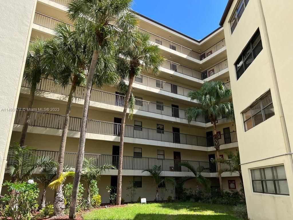 Photo of 2304 S Cypress Bend Dr #414, Pompano Beach, FL 33069 (MLS # A11493078)