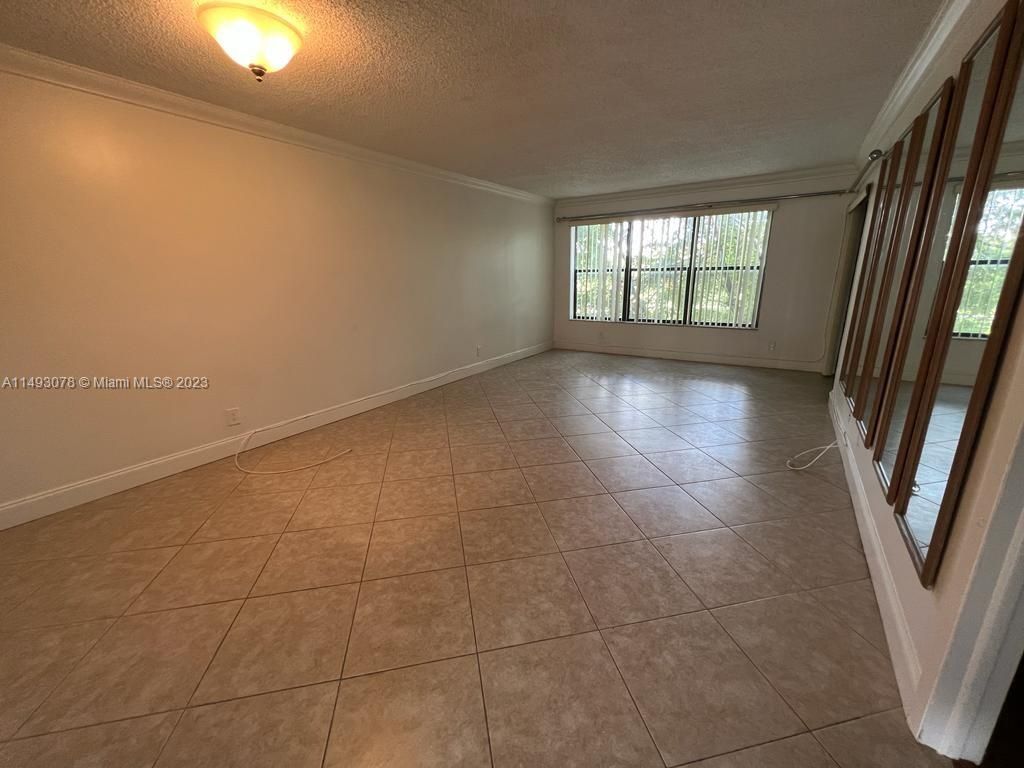 Photo of 2304 S Cypress Bend Dr #414, Pompano Beach, FL 33069 (MLS # A11493078)