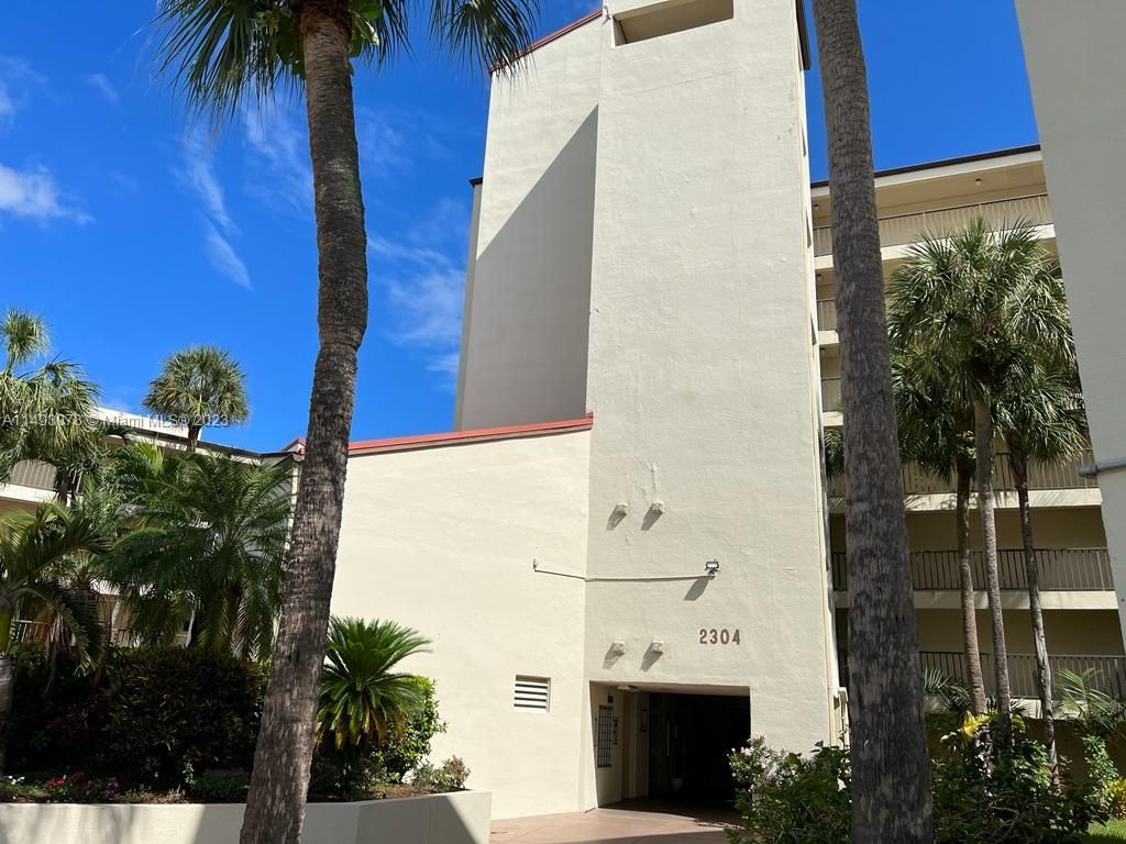 Photo of 2304 S Cypress Bend Dr #414, Pompano Beach, FL 33069 (MLS # A11493078)