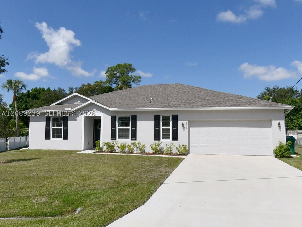 Photo of 702 SW Aster Rd, Port St Lucie, FL 34953 (MLS # A12089239)
