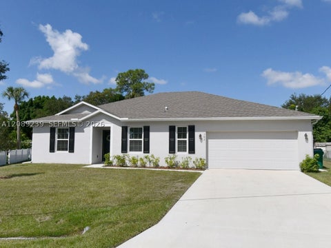 Photo of 702 SW Aster Rd, Port St Lucie, FL 34953 (MLS # A12089239)
