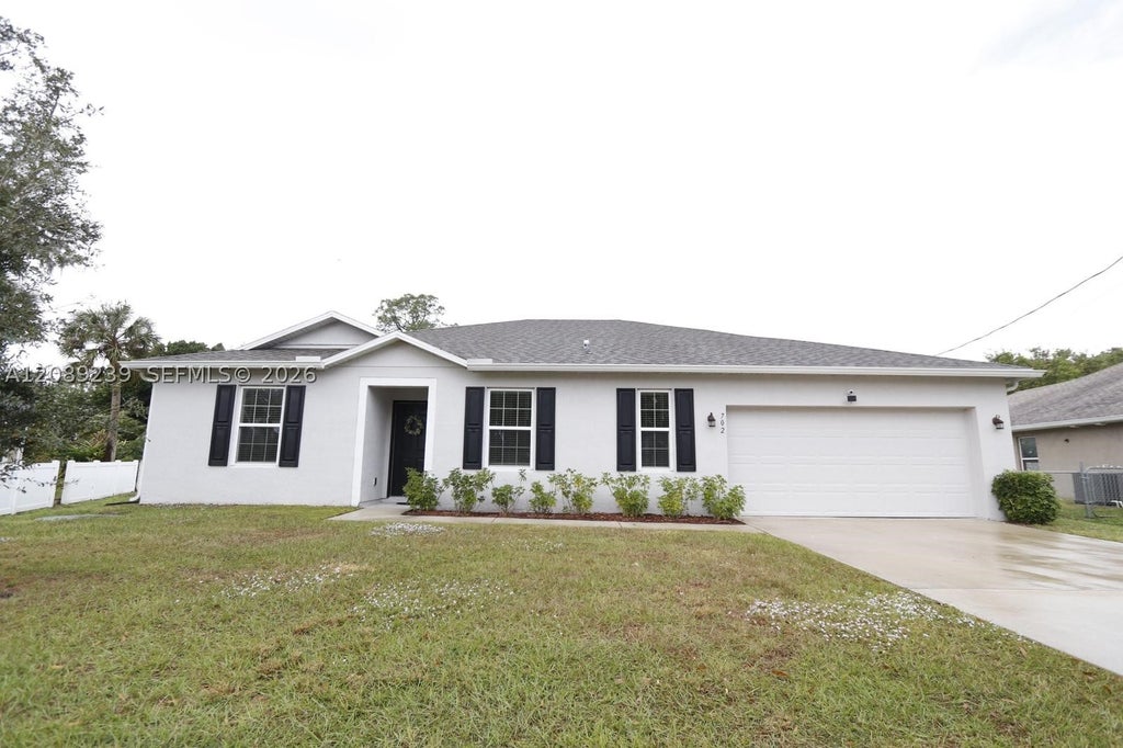 Photo of 702 SW Aster Rd, Port St Lucie, FL 34953 (MLS # A12089239)