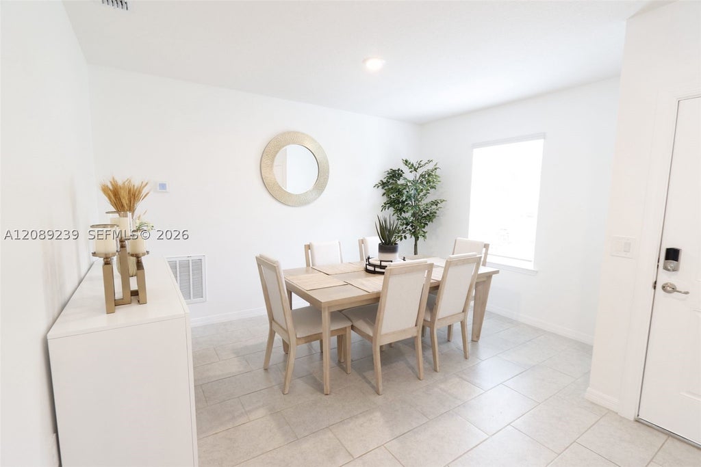 Photo of 702 SW Aster Rd, Port St Lucie, FL 34953 (MLS # A12089239)
