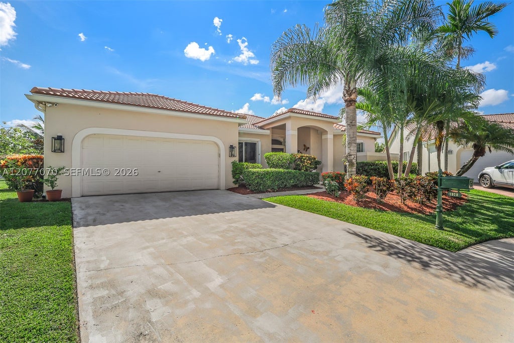 Photo of 1928 Water Ridge Dr, Weston, FL 33326 (MLS # A12077070)