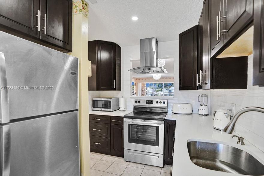 Welcome to this inviting 2-bed, 2-bath condo in the highly sought-after 55+ community of Pines of Delray North. Located on the 2nd floor with a serene lake view, this unit features a split floor plan, en-suite bathrooms for both bedrooms, and an in-unit washer and dryer. With only 8 units in the building, enjoy low maintenance and quiet living. The $587 monthly HOA fee includes cable, internet, water, and access to a fitness center, pool, tennis courts, and a clubhouse. The gated community provides 24/7 guard security, ensuring safety. Conveniently located near Atlantic Ave, Delray Beach, shopping, dining, and parks. The community is pet-friendly (emotional support or service animals only) and requires a minimum 640 credit score. No current or pending assessments and healthy reserves.