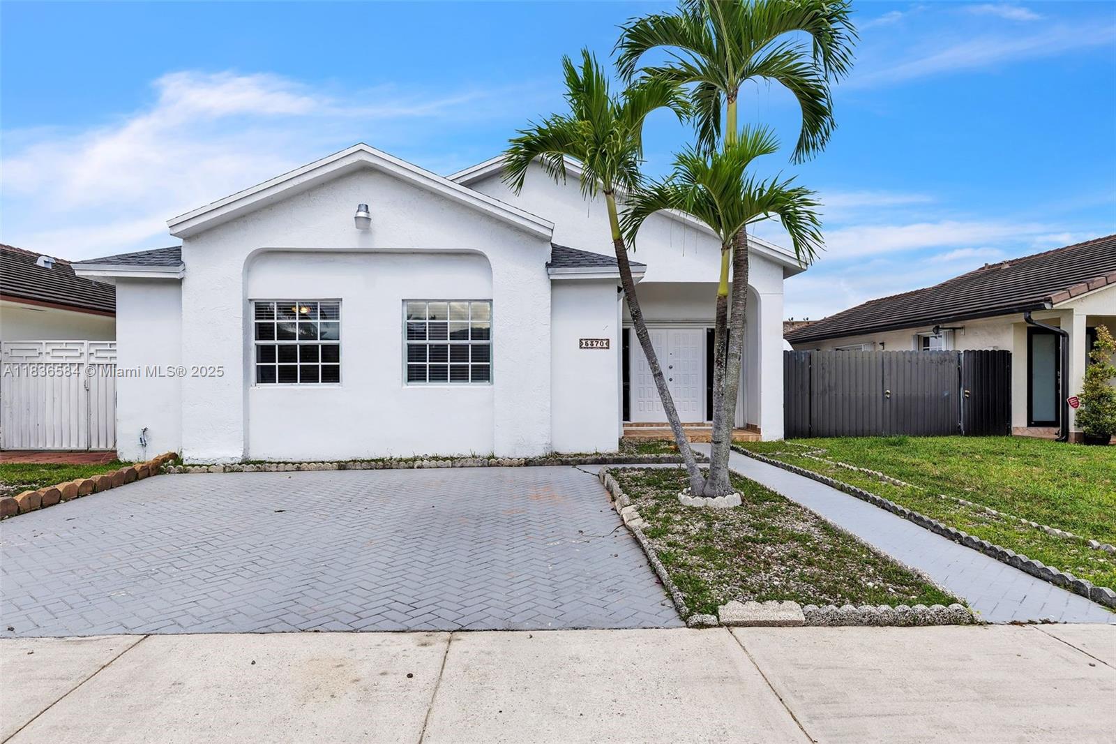 Move-in ready ranch home featuring a 3/2 layout, a covered back patio for year-round enjoyment, and a well-kept backyard that offers plenty of space for relaxation, play, or gardening.