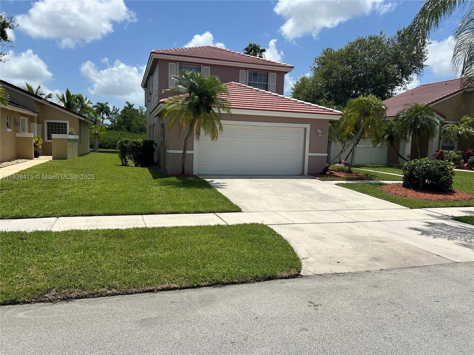 Well-maintained 4-bed, 3-bath waterfront home with newer roof, updated kitchen and baths, and new upstairs flooring (2024). Soaring ceilings in the living and dining areas create an airy, open feel. The kitchen offers granite counters, a large island, pantry, and eat-in area with impact sliding doors leading to the backyard and spacious family room with beautiful water views. One bedroom and a full bath downstairs is perfect for guests or multi-generational living. Laundry room provides ample storage. Accordion shutters upstairs and panel shutters downstairs offer storm protection. Enjoy the community pool, clubhouse, playground, and beach volleyball—amenities that make every day feel like a getaway.