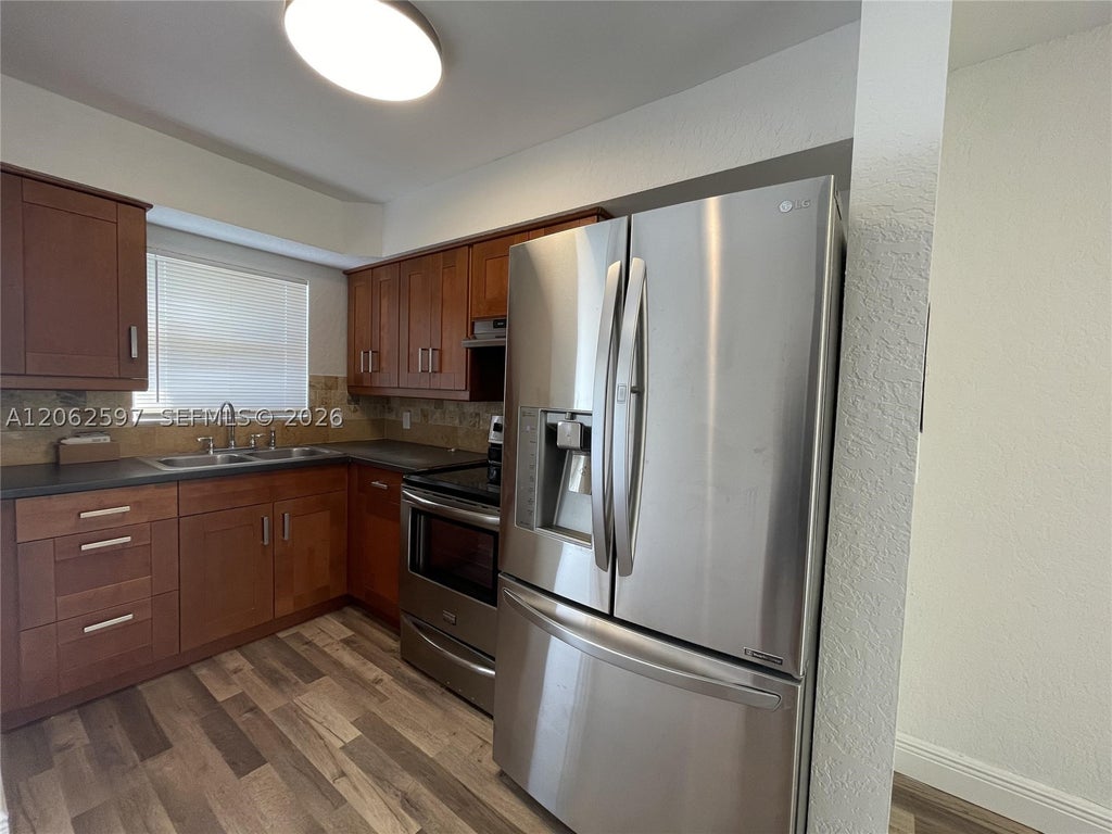Photo of 1959 SE 3rd St #C, Deerfield Beach, FL 33441 (MLS # A12062597)