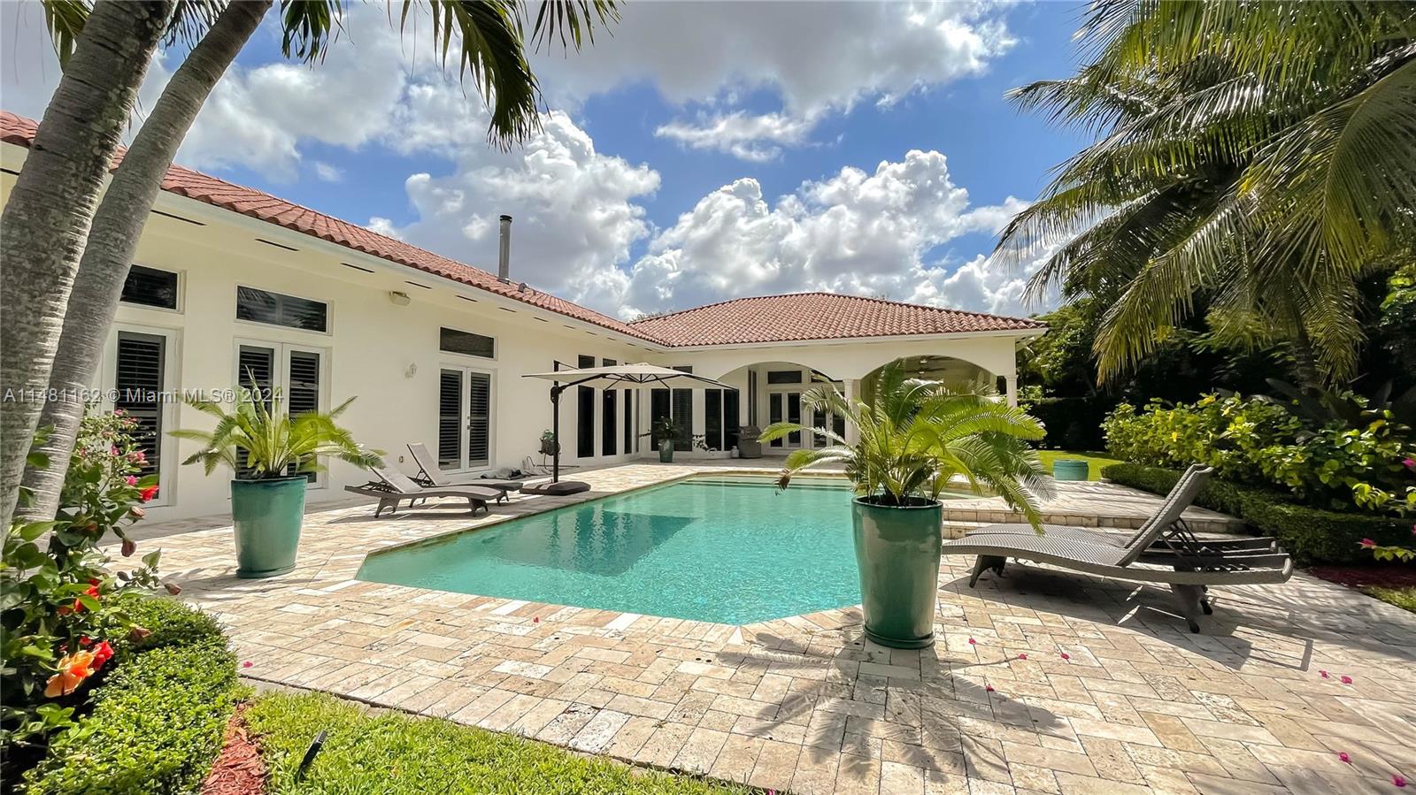 Amazing opportunity to own this beautiful one story Mediterranean style home located in the desirable area of North Pinecrest. This home features an elegant and bright great room with working fireplace, wet bar equipped with wine cooler & ice marker. Marble floors throughout, 5 bedrooms & 4 bathrooms. Amazing high ceilings with surround system throughout. The gourmet kitchen offers plenty of space & opens to family room and breakfast area, in addition to offering a formal dinning room. Impact windows & doors, multiple sets of french doors throughout the home that opens to the tranquile outdoor space, perfect for entertaining. Close to major highways, great shopping and restaurants in South Miami and Dadeland Mall. Excellent top Pinecrest public and private schools are all closed by.