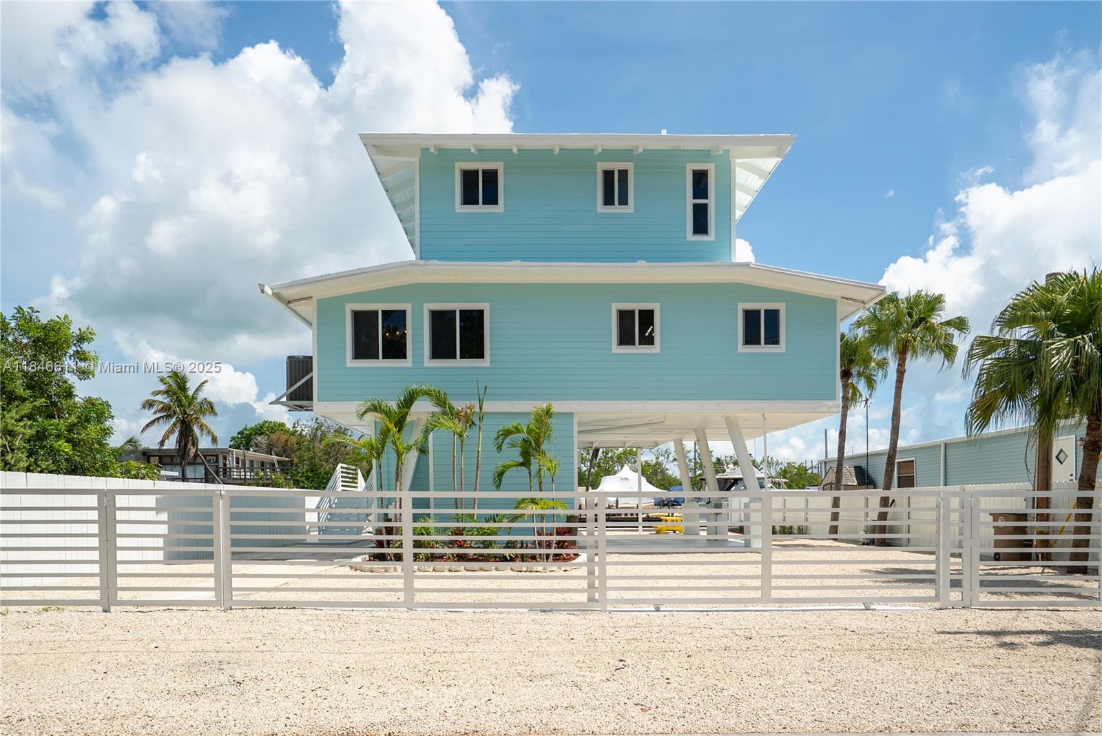 Waterfront Island Bungalow with 60' of Deep Water Dock on a wide canal with direct Bay Access. Welcome to the ultimate retreat in the Florida Keys! This recently renovated with new white kitchen, quartz counter tops, stainless steel appliances is ready for immediate occupancy. 3 new beautiful walk-in showers, impact windows and doors and new floors. Beautifully updated 2-bedroom, 2-bath Keys-style home is a true catch—offering 60 feet of concrete dockage with a boat lift and instant access to the bay, just load your gear, drop your lines, and be casting in world-class fishing waters within minutes. Freshly renovated interior with modern comfort with island charm. The open-concept kitchen is brand new, with stylish finishes and functionality for entertaining after a day on the water.