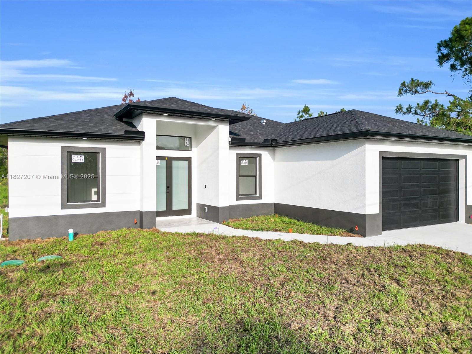 Stunning new construction featuring 3 bedrooms + den and 2 bathrooms, designed with modern elegance and functionality. Step into a bright, open layout with soaring double-height ceilings and sleek porcelain flooring throughout. The modern kitchen boasts quartz countertops, luxury Gola-style handles, soft-close cabinets, and stainless steel appliances. Both bathrooms feature contemporary finishes and quartz countertops, with the master offering a spacious walk-in shower. Impact-resistant windows and doors flood the home with natural light. Outside, enjoy a full sprinkler system and peace of mind with the builder’s warranty. A perfect blend of quality, style, and comfort—this home is a must-see.