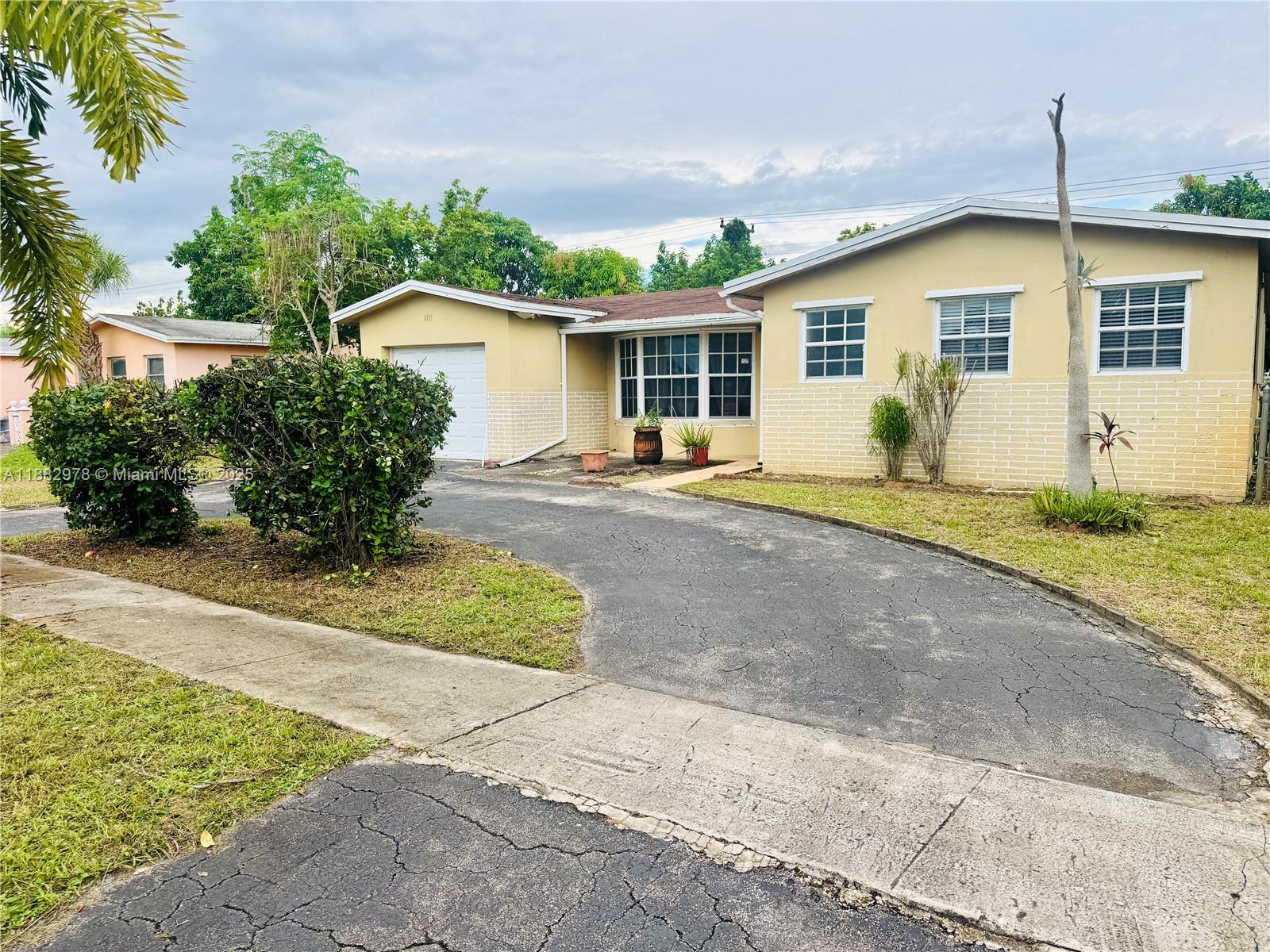 Spacious 3-bedroom, 2-bathroom home with just under 1,800 sq ft of living area plus a closed and finished Florida room for extra space. Features include a large master bedroom, circular driveway, and solid layout with plenty of potential. Conveniently located near the Turnpike, 441, and Sunrise Blvd. Priced right and ready for your personal touch.