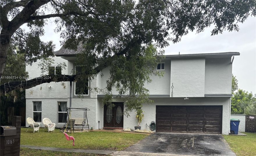 Prime Location! The perfect blend of comfort & convenience in this spacious 4-bdrm, 3.5-bath home in desirable Cooper City school district. Enjoy waterfront living w/ direct access to the lake. Beautiful 36x24 porcelain tile floors downstairs & laminate wood upstairs. Open floor plan features a new kitchen w/ wood cabinets, quartz countertops, & ss appliances. Cabana bath & powder room downstairs. All bedrooms upstairs, incl. the master suite w/ a walk-in closet & a private ensuite bathroom. The 2nd upstairs bathroom offers dual sinks & a combo shower & tub. Dual A/C units (approx. 6 y.o.) zoned upstairs & downstairs. Converted garage has a small office space w/garage door in working order. Roof replaced in 2015 & impact glass windows thru out. Automatic sprinklers use water from the lake.