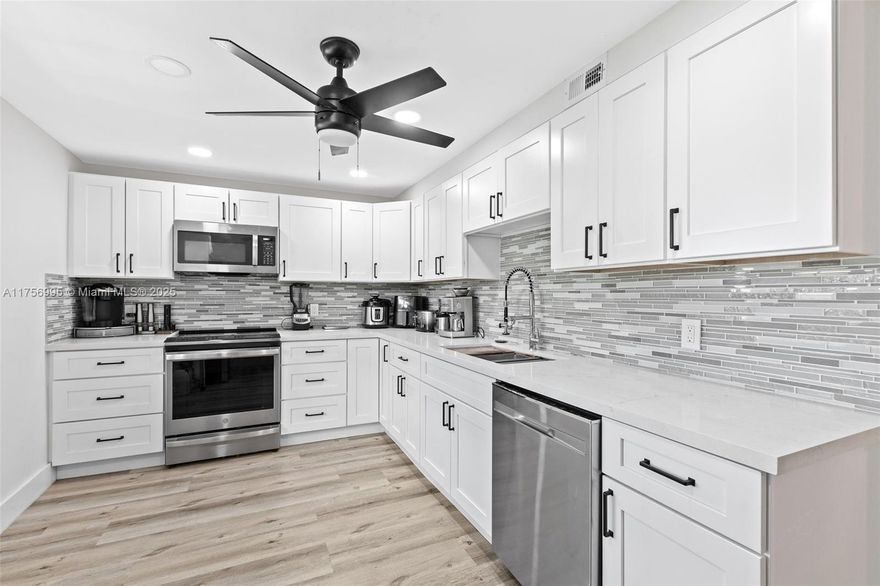 Stunning 3 Bedroom, 2.5 Bath Condo in Cypress Grove at Palm Aire Country Club. This Beautifully Updated Condo Features a Modern Kitchen with Ample Cabinetry and SS Appliances, A Spacious Split Bedroom Floor Plan and Elegant Finishes throughout.  The Primary Suite Boasts a Walk In Closet, Two Additional Closets and a Luxurious En-Suite Shower with Double Sinks, Frameless LED Vanity Mirrors and a Sleek One Piece Toilet.  Two Generously Sized Bedrooms and Renovated Bathrooms add to the Homes Appeal.  Enjoy the Convenience of an In-Unit Laundry Room with Washer & Dryer, Living Room/Dining Room Combo that Leads to a Screened Balcony with Breathtaking Golf Course and Lake View.