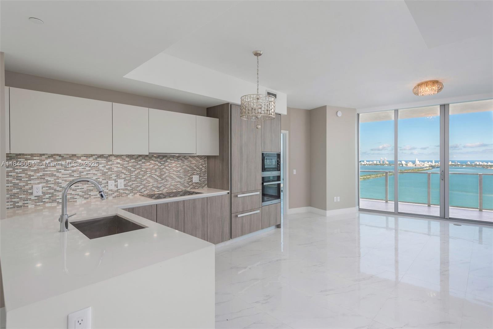 Live in East Edgewater's most exclusive luxury bayfront tower. Beautiful 2 bedroom + Den, 3 full baths on high floor. Direct Biscayne Bay views with Miami Beach and the Ocean in the backdrop. Miele and Subzero appliances, Snaidero kitchen, white quartz countertops. Incredible amenities- Tennis & Basketball courts, state of the art Fitness Center, Spa treatment rooms, sauna & steam rooms, private beach club with day beds, lounges, and individual cabanas, recreation rooms, two pools & hot tub – this is one of Edgewater’s most desirable and luxurious buildings. Please note that balconies will be closed estimated time frame is August 2025-December 2025.