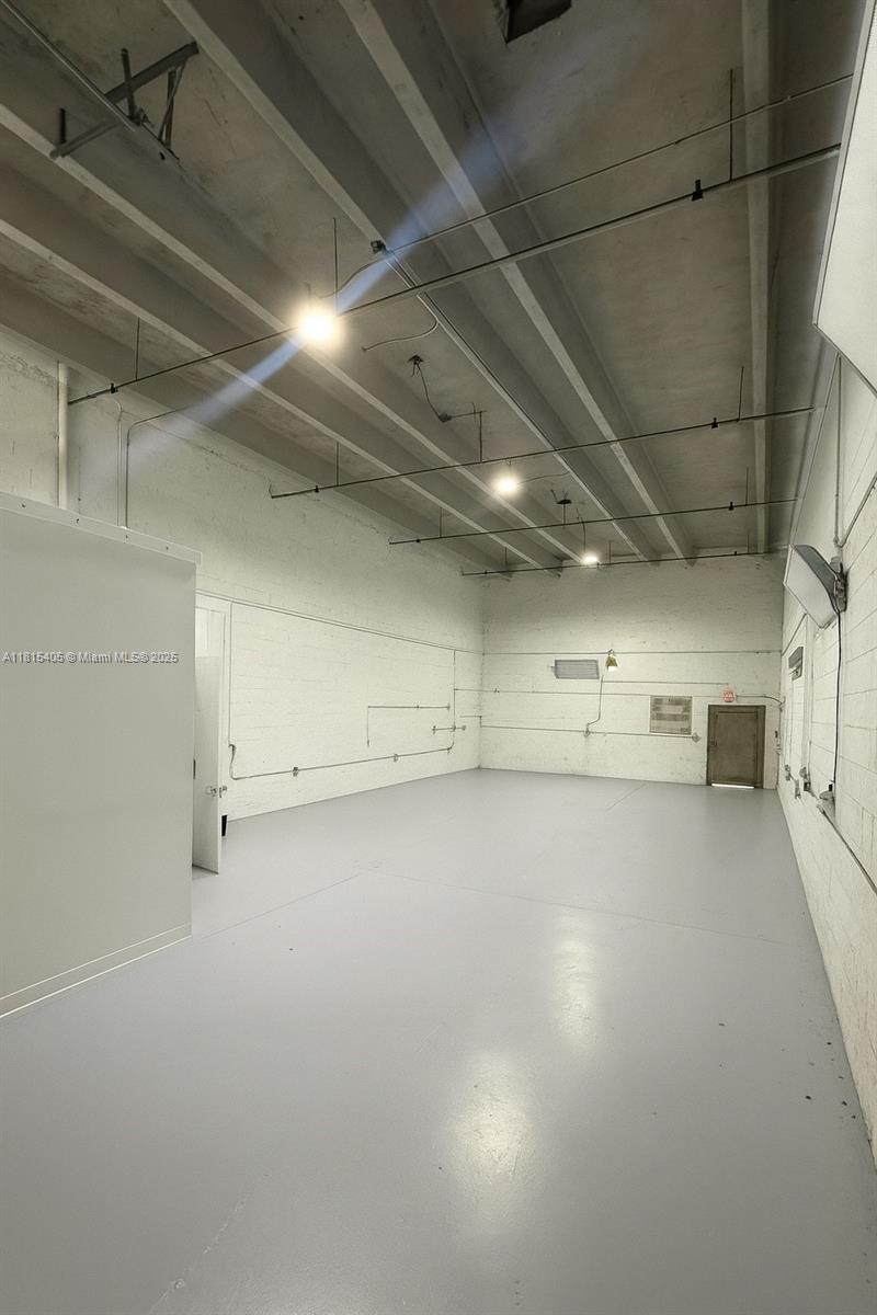 Large warehouse with roll up street level bay in the front of the unit with acess to the interior space.
air-conditioned finished office area at front of unit, as well as a bathroom located in the warehouse space immediately behind the office. The bldg has reinforced CVS exterior walls, poured concrete floors, and T-beam precast roof with a built up finish.