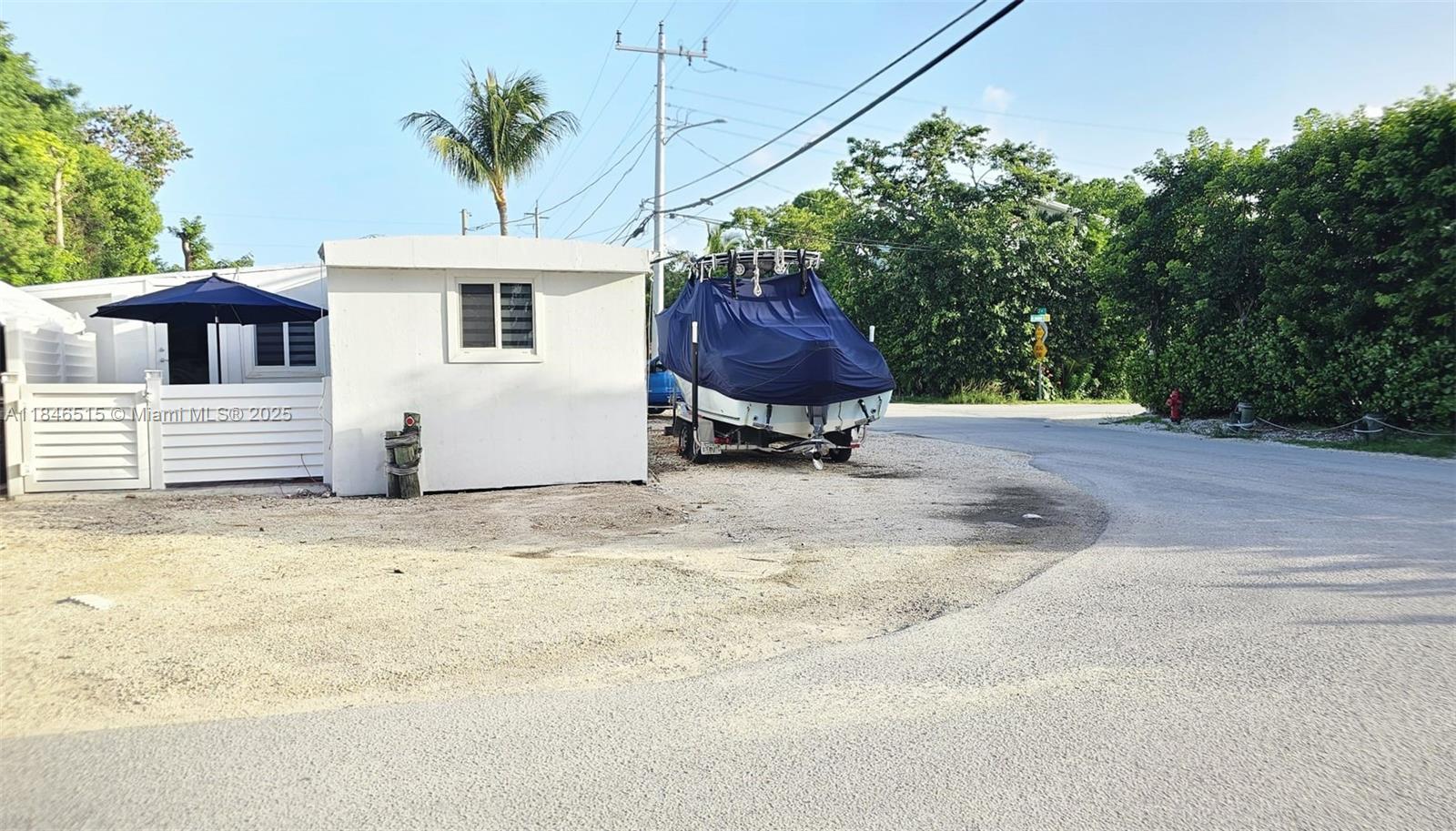 COMPLETELY REMODELED trailer home for rent in sought after Key Largo, FL! This CORNER lot, 2 bed, 2 bath home boasts new tile flooring throughout, stainless steel kitchen appliances, beautiful full baths, zebra blinds, plenty of parking, room for a boat, and washer and dryer included. Down the street from Gilbert’s, The Big Chill, and shopping at Publix and Dollar Tree—all accessible by golf cart! Come enjoy this effortless gem in Key Largo!