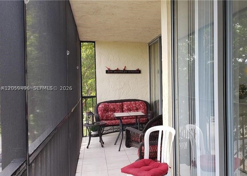 Photo of 3821 Environ Blvd #406, Lauderhill, FL 33319 (MLS # A12059496)