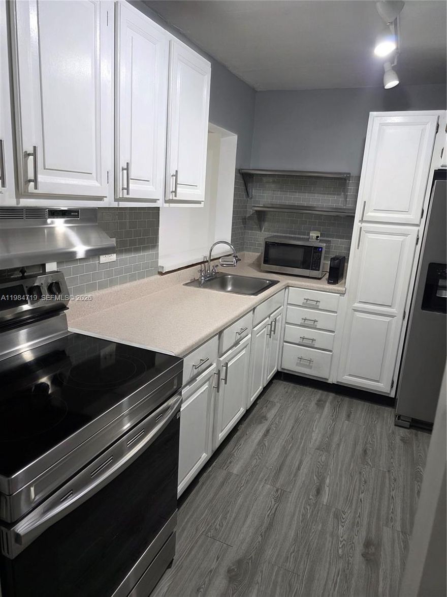 VERY SOUGHT AFTER HORIZONS (EAST) CONDO, 2 BEDROOMS, 2 BATHS, ON 2ND FLOOR, REMODELED KITCHEN WITH STAINLESS STEEL APPLIANCES (STOVE & HOOD REPLACED, REFRIGERATOR REPLACED 2 YRS AGO, MICROWAVE ALSO REPLACED) NEWER BLACKSPLASH AND CABINET HANDLES ALSO REPLACED, 2 DOOR REFRIGERATOR WITH WATER/ICE DISPENSER, STAINLESS STEEL SHELVES IN KITCHEN, EXTRA PANTRY CABINET FOR MORE STORAGE, UPDATED MASTER BATH WITH SHOWER, NEW WATERPROOF FLOORING INSTALLED IN L/R, D/R, KITCHEN , HALLWAY, AND FOYER. WATERPROOF VINYL FLOORING INSTALLED ON BALCONY, SCREEN BALCONY WITH STORAGE ROOM, REPLACED A/C CONDENSING UNIT ON ROOF IN 2021, HORIZONS OFFERS GREAT AMENITIES: (3) POOLS, (4) TENNIS COURTS, BEAUTIFUL CLUBHOUSE, GYM, 24 HOUR GUARD AT GATE PLUS ROVING GUARD IN EVENING HOURS, LOTS OF GUESTS PARKING , PLUS (1) ASSIGNED PARKING SPACE, LAUNDRYROOMS ON EACH FLOOR (3)WASHING MACHINES AND (3) DRYERS PER FLOOR, BEAUTIFUL PARK ACCROSS THE STREET FROM HORIZONS (INDIAN HAMMOCKS PARK), BUILDING HAS COMPLETED AND PASSED THEIR 40 YEAR CERTIFICSATION AND THERE ARE NO SPECIAL ASSESSMENTS.