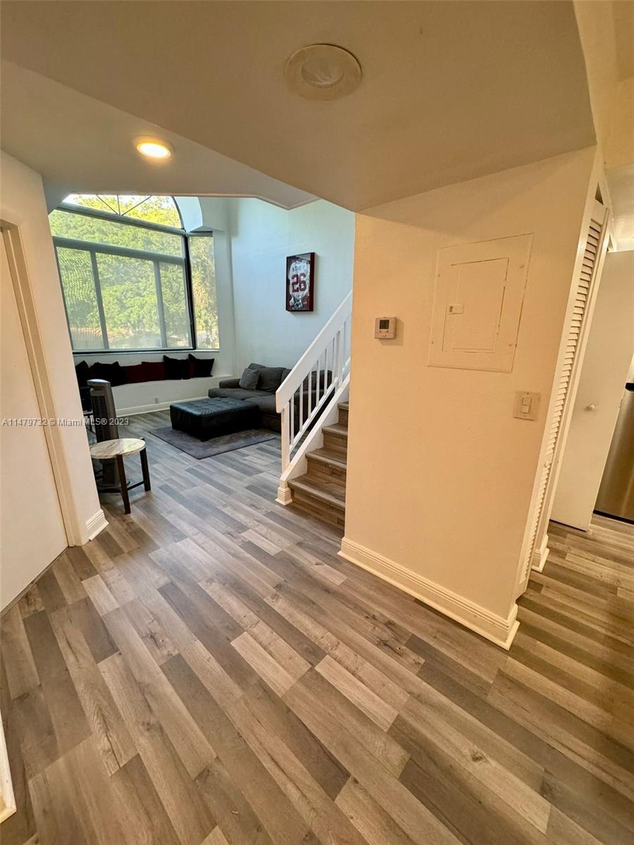 BEAUTIFUL HIGHLY SOUGHT AFTER TWO-LEVEL TOWNHOUSE CONDO IN THE HEART OF MIAMI LAKES, SPACIOUS LIVING AREA W LARGE WINDOWS ALLOWING AN ABUNDANCE OF NATURAL LIGHT, BRAND NEW WOOD FLOORING, UPDATED KITCHEN W/QUARTZ COUNTER TOPS, STAINLESS STEEL APPLIANCES, ONE BED AND BATH DOWNSTAIRS, CORNER UNIT IMPACT/SOUNDPROOF WINDOWS THROUGHOUT, A MUST SEE!